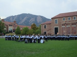 The CU band warms up with the Flatirons in the background